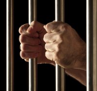 hands on jail bars