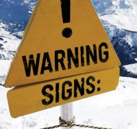 warning sign on mountain